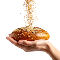 A Hand Holds A Round Sesame Seed Bun As More Seeds Fall Onto Its Surface isolated on transparent background. PNG die-cut for advertising