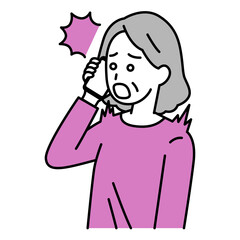 スマートフォンでの通話で驚く年配の女性