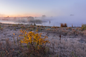 morning fog on the river at autumn sunrise