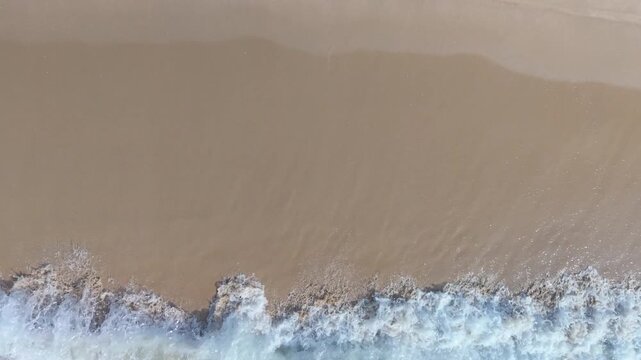 Summer seascape beautiful waves, blue sea water in sunny day. Royalty high-quality free best stock of tranquil beach with turquoise waves splashing, sand shore. Aerial view, tropical nature background
