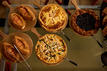 Variety of baked dishes displayed on wooden serving boards