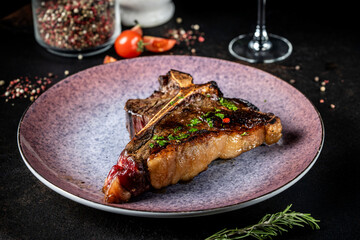 Juicy grilled T-bone steak with garnish