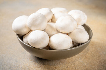 Fresh white mushrooms in bowl