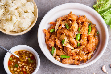 Fried pork with garlic and fresh chili and sticky rice.