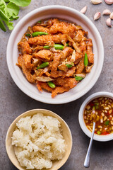 Fried pork with garlic and fresh chili and sticky rice.