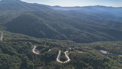 Aerial view of winding asphalt mountain road among green trees in summer. (Domaniç,İnegöl dağ yolu)	