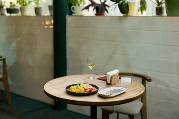 Enjoy a cozy dining atmosphere with exquisite wine and delicious pasta in a trendy cafe