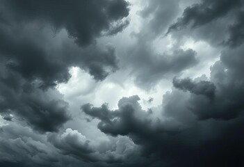 Obraz premium Ominous, swirling dark gray and black storm clouds fill the frame, nature photography, dramatic