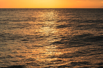 Golden Sunlight Reflecting on the Ocean Surface