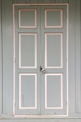 wooden door and window of wood house , pastel color , thailand