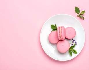 Pink macarons on a white plate, pastel background