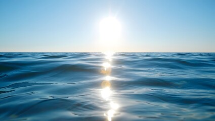 Obraz premium Sunlight reflecting on the ocean water creating a beautiful and bright scenery view