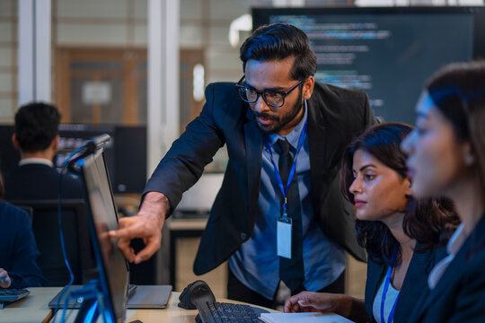 Group of programmers are coding at office.