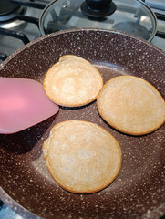 Pancakes are fried in a frying pan without oil.
