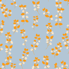 Seamless vector pattern featuring wild floral stems with yellow leaves and delicate white blossoms on a soft blue background. Template for fabric, stationery, and packaging designs