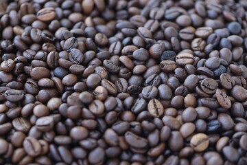 Coffee texture roasted beans from above soft light. Big amount of coffee