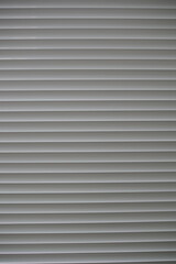 close up of aluminium window blinds , inside house
