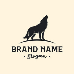 Naklejka premium Silhouette of a howling wolf on a hill, with brand name and slogan below.