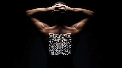 Man with hands behind head and qr code on back in dark setting with dramatic lighting effect - Powered by Adobe