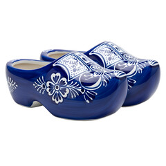Pair of blue and white Delftware clogs with floral patterns on white or transparent background