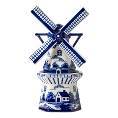 A blue and white Delftware windmill with blades on white or transparent background