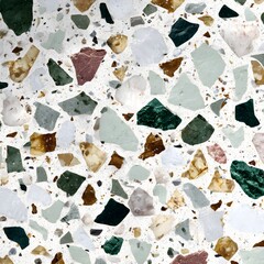 Terrazzo background with flat surface and seamless texture, in white and beige colors with small brown, green, and black stones.
