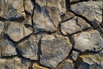 Fototapeta premium Photo of Brown pebble stone paving surface. Background texture for backdrops or mapping