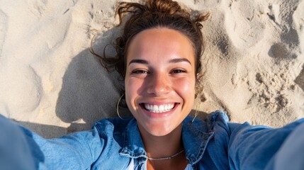 Woman smiling at camera on beach.