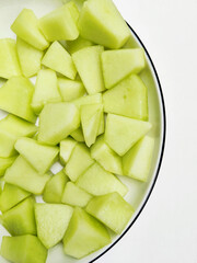 A Bowl Full of Freshly Cut Honeydew Melon Chunks Ready for a Summer Snack