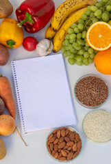 Healthy Meal Planning: Notebook for Recipes Surrounded by Fresh Produce
