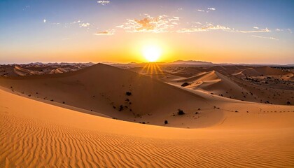 Desert sunset panorama.  Golden dunes meet sunrise