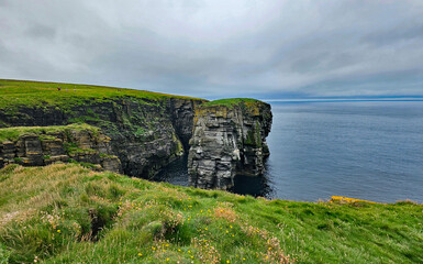 Wonderful views of the cliffs with islands and birds in the Scottish Highlands near Thurso