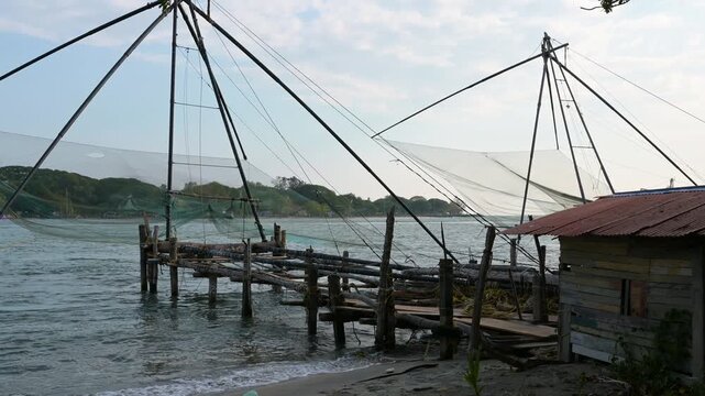 Chinese fishing nets on the shore of Kochi, Kerala in India, Cheena vala or tangkul, traditional stationary lift net