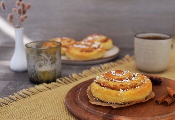 Cinnamon bun (kanelbulle) with coffee.Traditional Swedish fika.