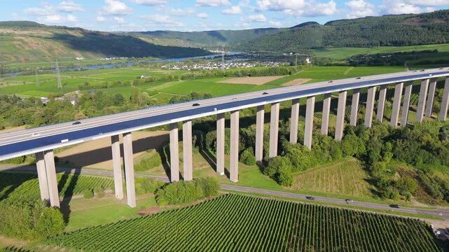 Moselle Viaduct Longuich, vineyard in Mosel valley, bridge of highway crossing river near Trier, german autobahn, aerial view