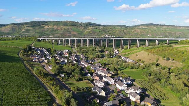 Moselle Viaduct Longuich, vineyard in Mosel valley, bridge of highway crossing river near Trier, german autobahn, aerial view