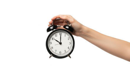 Hand holding an old fashioned alarm clock isolated on transparent background