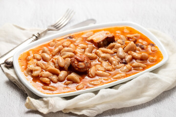 typical portuguese dish chispalhada with beans in dish