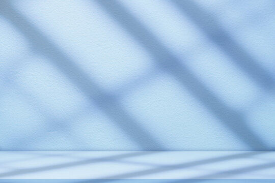 Fototapeta Blue Background Studio with Gradient White Light on Podium stage for Product Display Present,Empty Backdrop wall texture with abstract sun light on floor concrete in pastel blue tone color for Winter