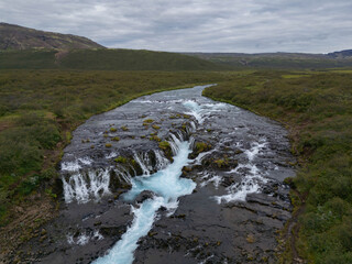 Aerial View of Bruarfoss Waterfall in Iceland with Turquoise Glacial Water
