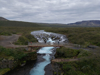 Aerial View of Bruarfoss Waterfall in Iceland with Turquoise Glacial Water
