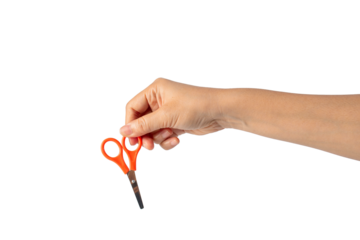 Small orange scissors in hand on transparent background