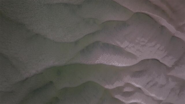 Aerial view of sand formations in clear, shallow, water creates a mesmerizing pattern of textures and tones: a natural artistic display. Gray's Beach, Yarmouth Port, Cape Cod, Massachusetts, USA.