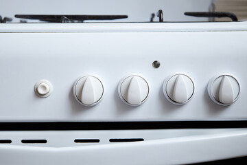 Gas supply switches at white gas stove for cooking