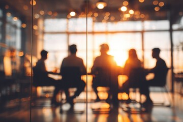 a business team is having a meeting in a conference room with glass walls, with a blurred background. this abstract business concept could be used for a banner design.