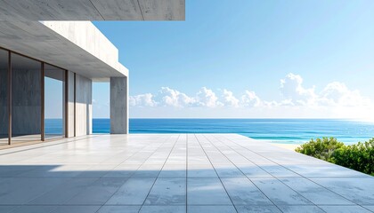 Modern seaside patio with white concrete structure overlooking the ocean on a sunny day