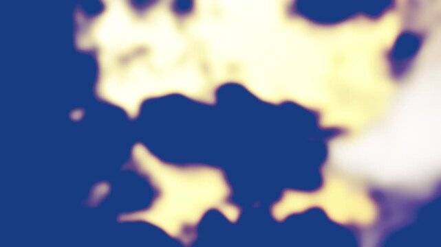 Graphic looping animation with dark blue, blurry spots or clouds moving from the top left to the bottom right on a light yellow background.