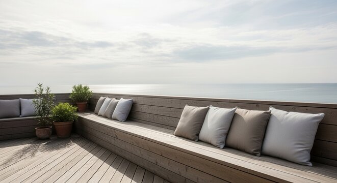 Scenic ocean view from a tranquil wooden deck with cozy cushions and plants offers serenity - Powered by Adobe