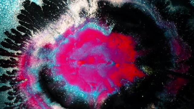Close-up of colorful substances mixing in vibrant patterns and textures