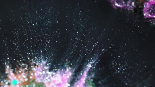 Macro shot of colorful substances mixing with artistic flair
